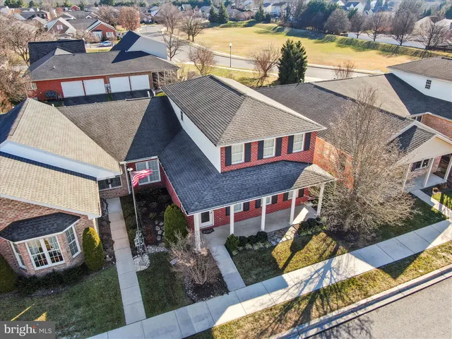 a aerial view of a house with swimming pool