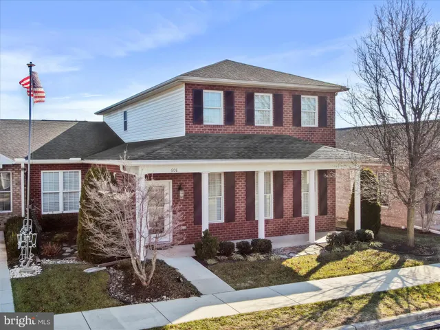 a view of a street with a large tree