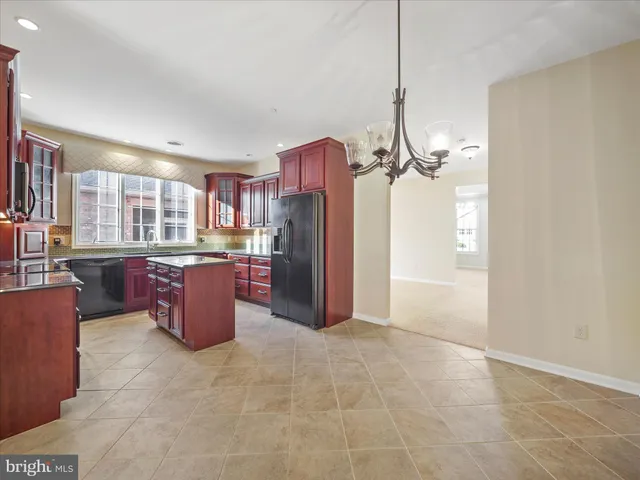 a view of an empty room with a fan