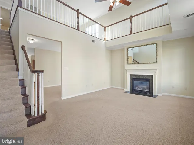 a view of empty room with fireplace