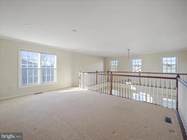 a bathroom with a granite countertop sink mirror vanity and toilet