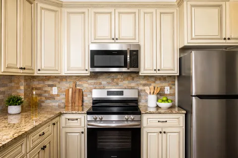 a kitchen with a sink a counter and dining table
