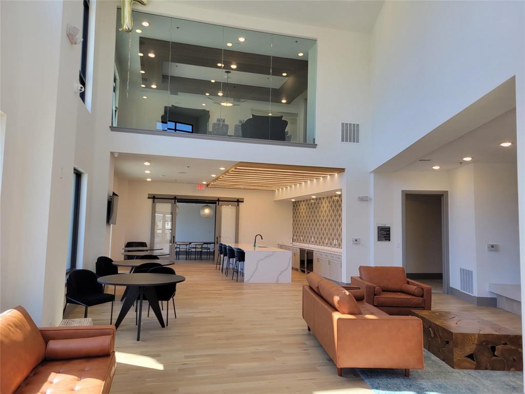 2700 Old Denton Road, Unit 3362 Carrollton, TX 75007 - Photo 11 of 19 a living room with furniture and a glass door
