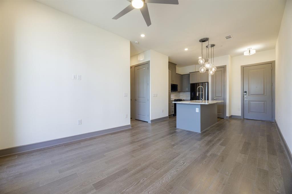 2700 Old Denton Road, Unit 3362 Carrollton, TX 75007 - Photo 4 of 19 a view of kitchen with wooden floor