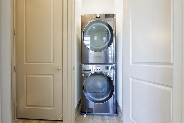 a close view of a utility room with dryer and washer