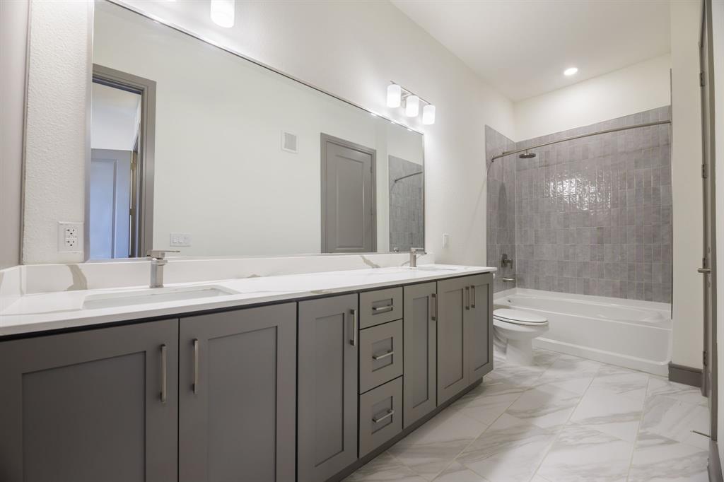 2700 Old Denton Road, Unit 3362 Carrollton, TX 75007 - Photo 6 of 19 a bathroom with double sink and a mirror