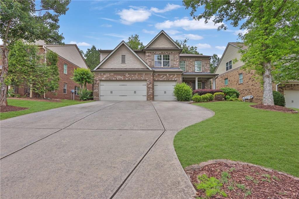 1515 Riva Ridge Suwanee, GA 30024 - Photo 2 of 35 front view of house with a yard
