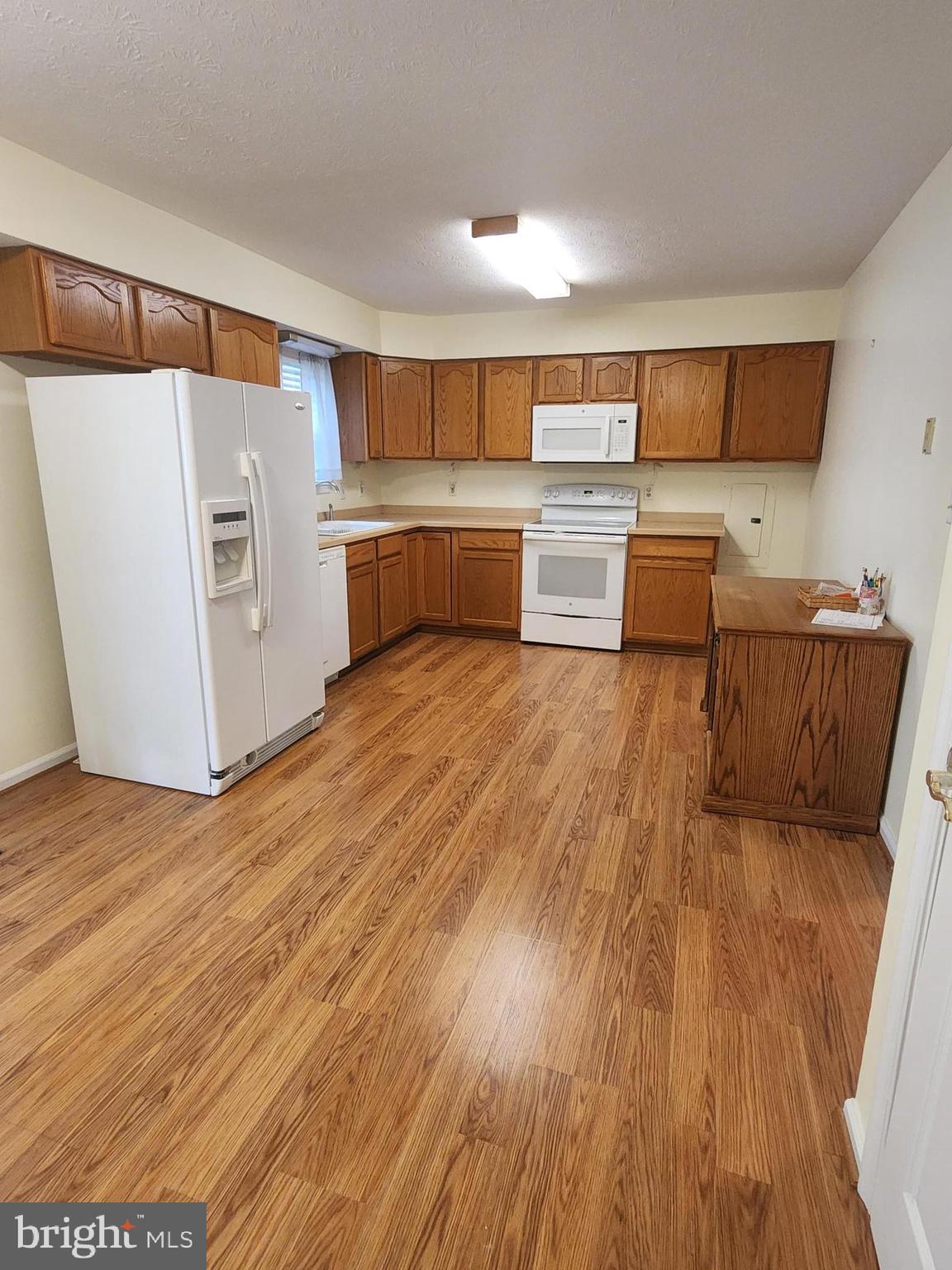 6017 Maple Road St. Leonard, MD 20685 - Photo 4 of 13 a view of kitchen with wooden floor