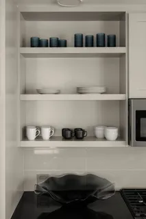 a shelf with a potted plant on it