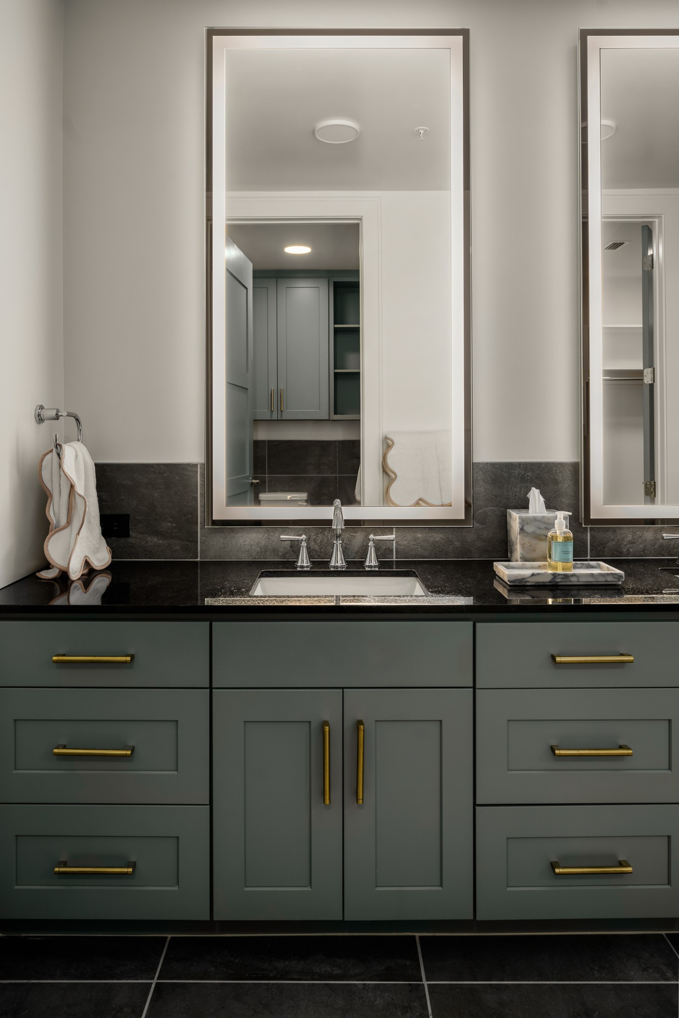 930 Commerce Street, Unit 12 Nashville, TN 37203 - Photo 24 of 57 a bathroom with a sink and a mirror