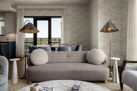 a living room with furniture and a window