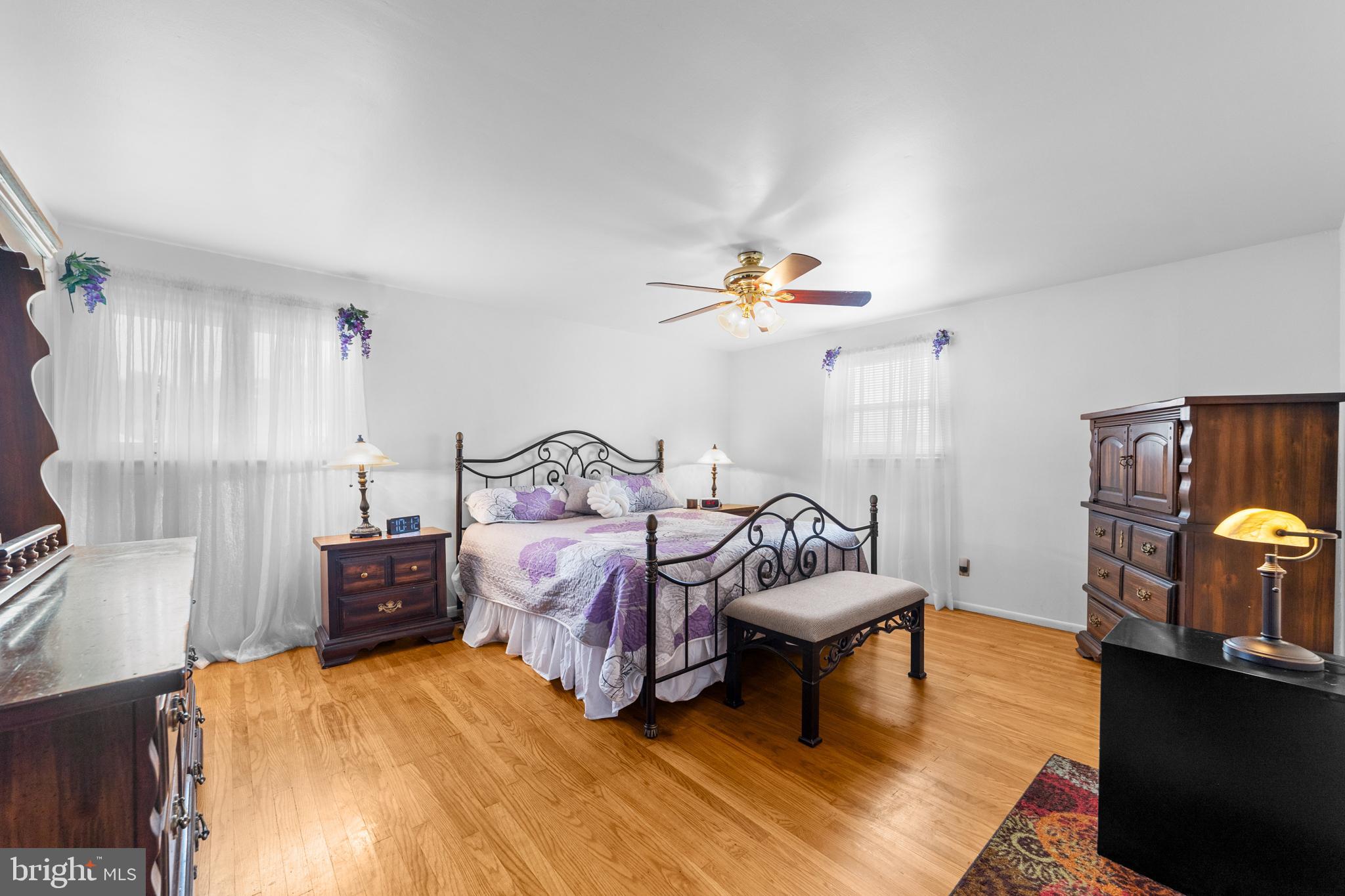 1606 Gordon Road Burlington, NJ 08016 - Photo 21 of 35 a bedroom with a bed and a chandelier
