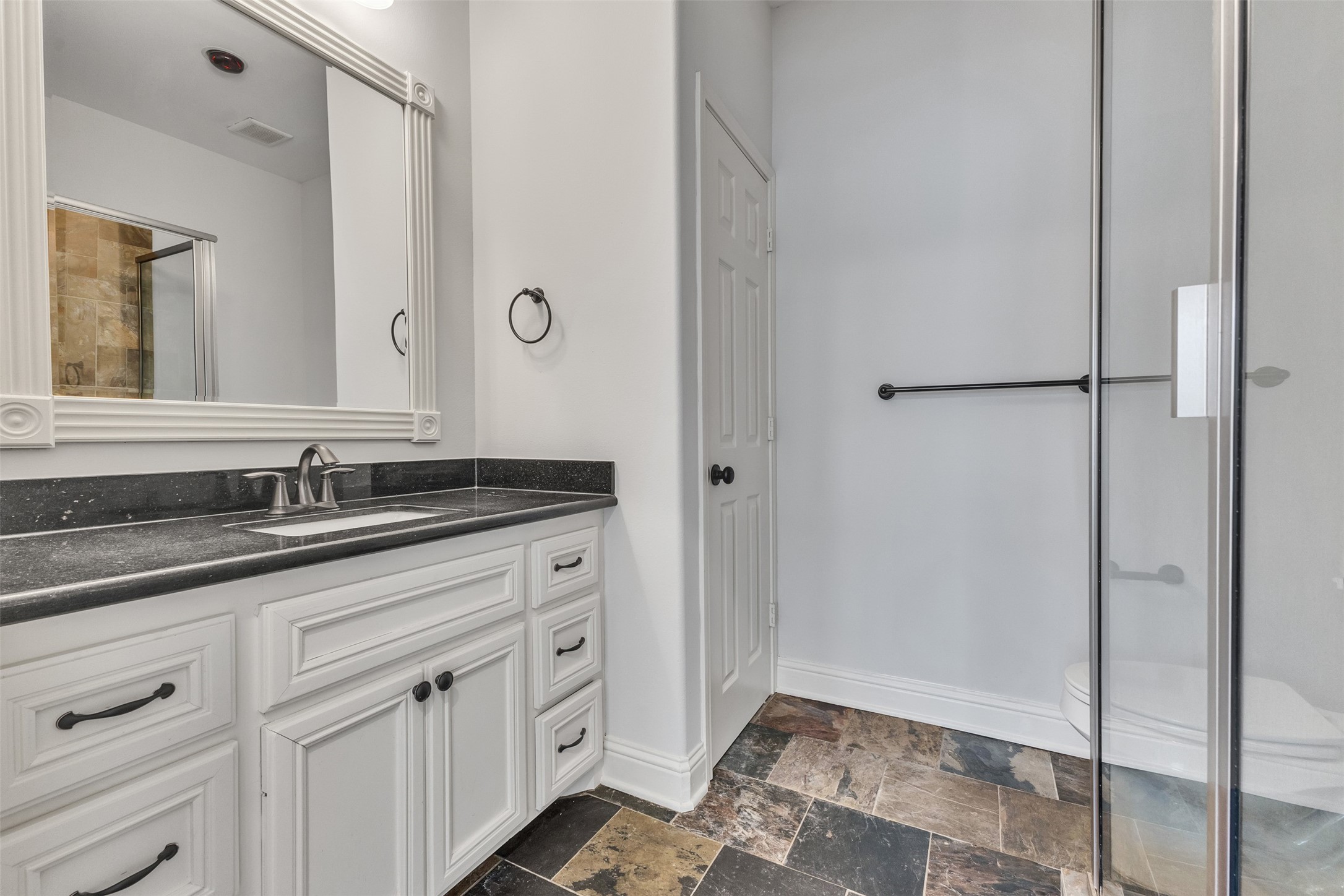 3911 Kennon Street, Unit A Houston, TX 77009 - Photo 12 of 14 a bathroom with a sink and a mirror