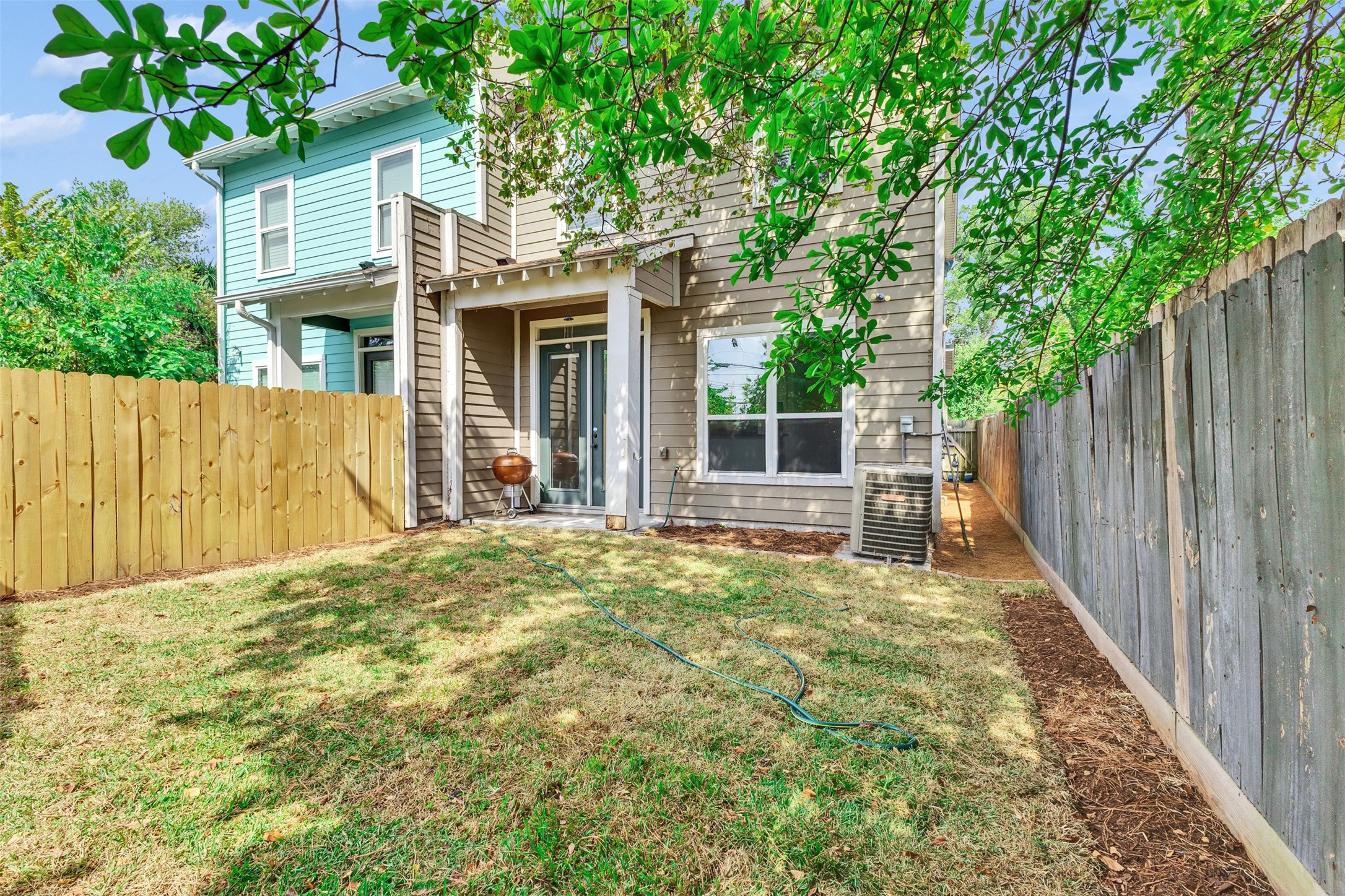 3911 Kennon Street, Unit A Houston, TX 77009 - Photo 13 of 14 a front view of a house with a yard