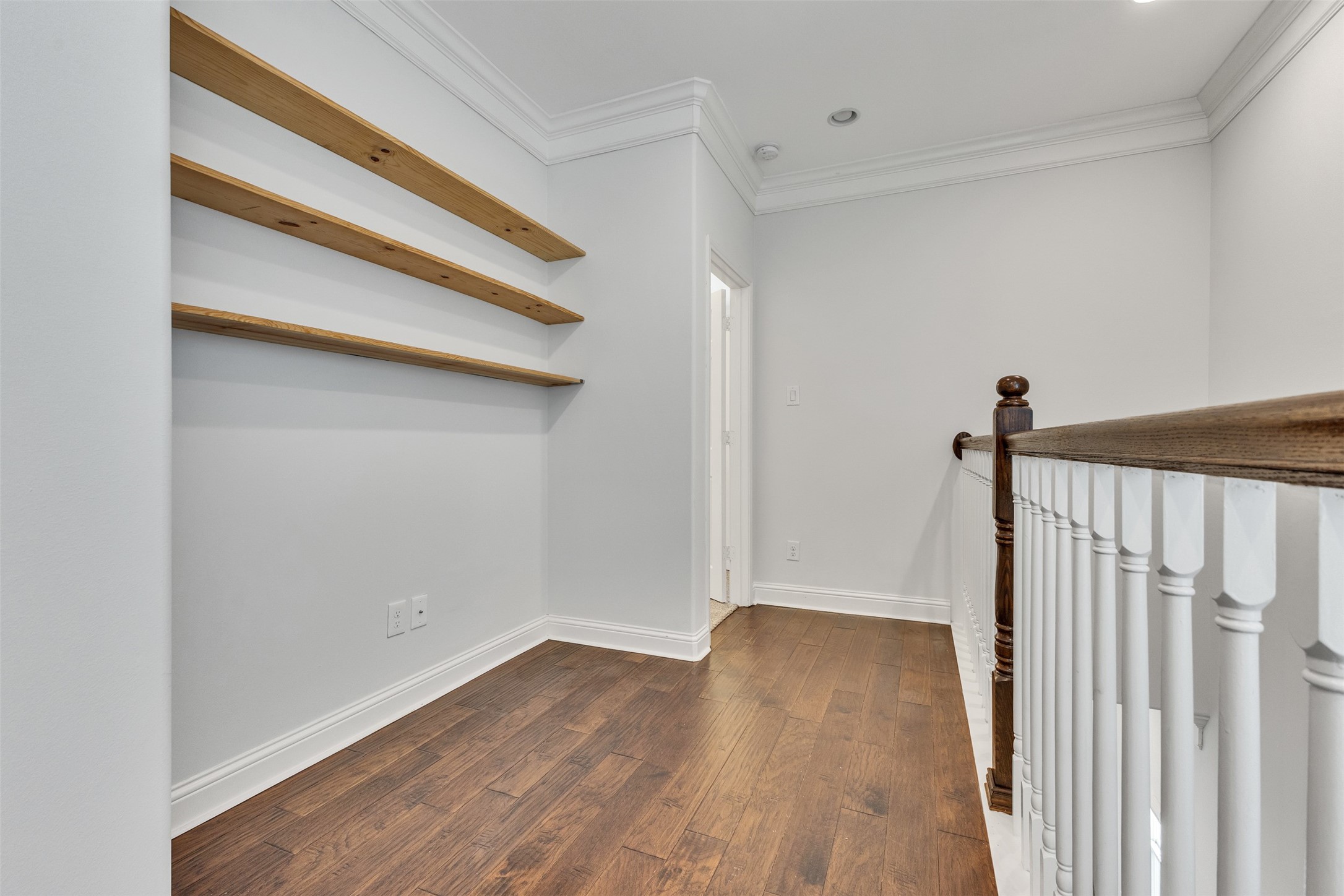 3911 Kennon Street, Unit A Houston, TX 77009 - Photo 9 of 14 a view of a hallway with wooden floor and staircase