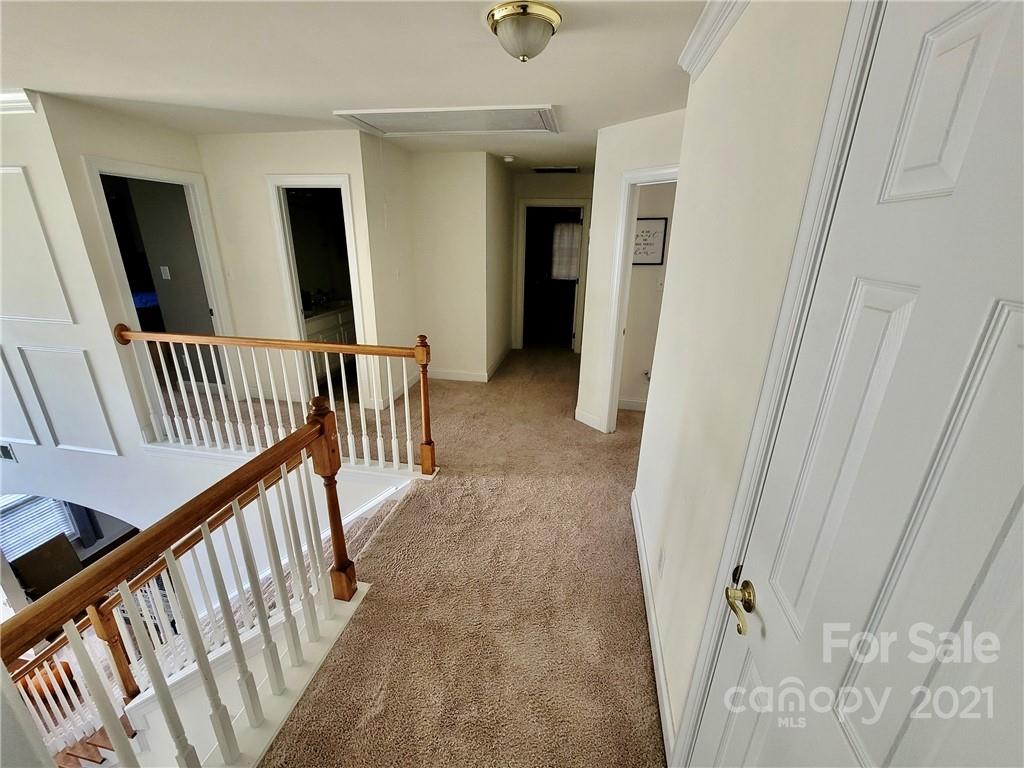 11402 Woodfire Road Charlotte, NC 28269 - Photo 20 of 24 a view of a hallway view with staircase