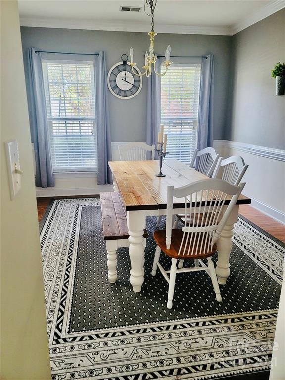 11402 Woodfire Road Charlotte, NC 28269 - Photo 5 of 24 a view of a dining room with furniture and window