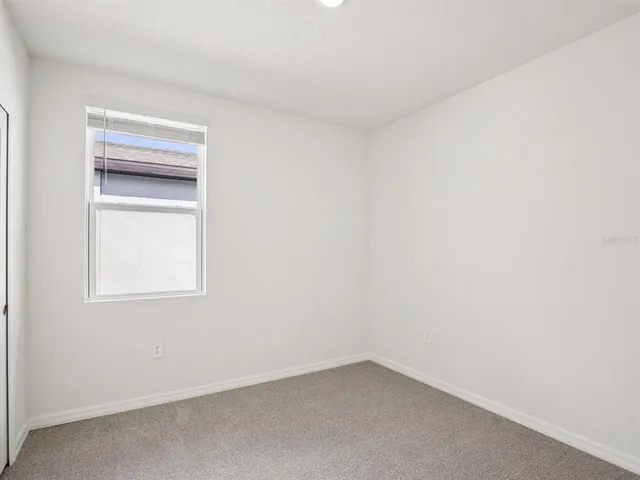 an empty room with a bathroom