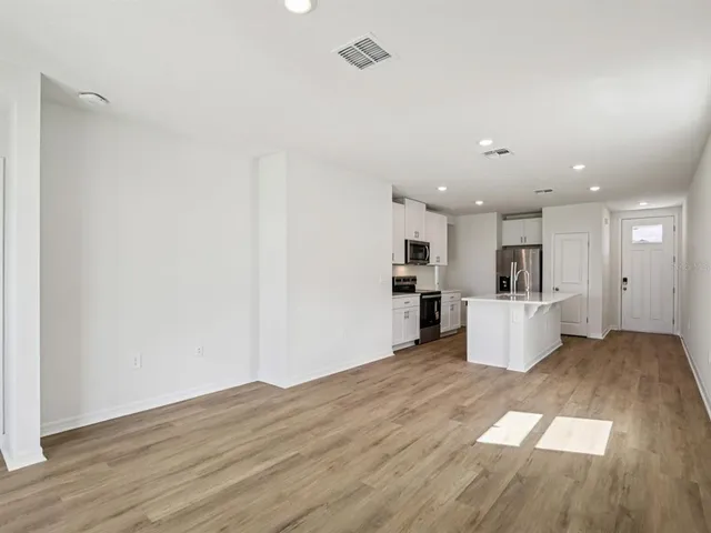 a view of kitchen with wooden floor
