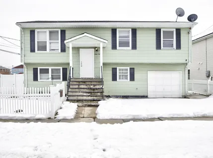 a front view of a house with a outdoor space