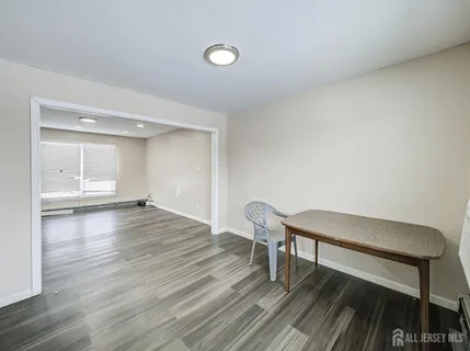 a kitchen with granite countertop a sink stove and cabinets