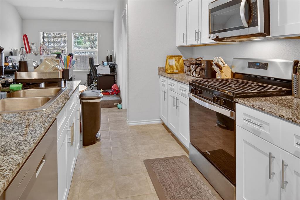 536 Bronze Circle East Springtown, TX 76082 - Photo 11 of 28 a kitchen with sink cabinets and utility