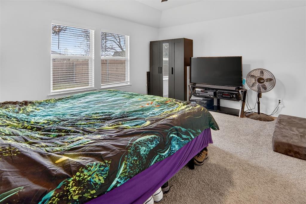 536 Bronze Circle East Springtown, TX 76082 - Photo 16 of 28 a bedroom with a bed and a flat screen tv