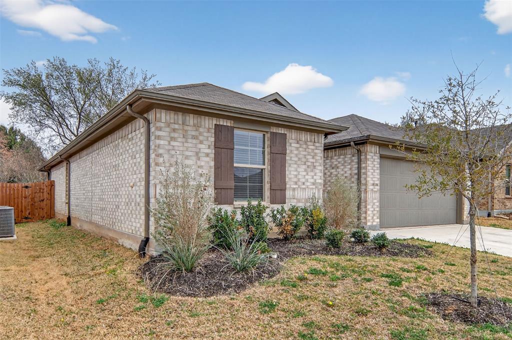 536 Bronze Circle East Springtown, TX 76082 - Photo 2 of 28 a front view of a house with garden