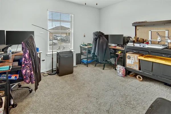a view of a room with workspace and windows