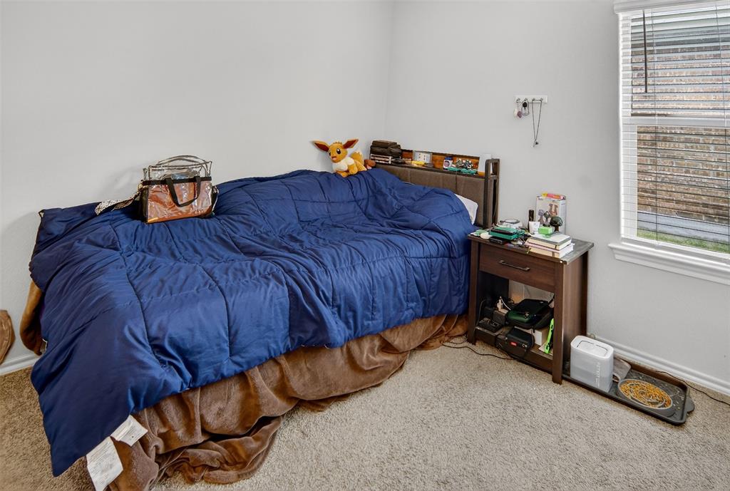 536 Bronze Circle East Springtown, TX 76082 - Photo 22 of 28 a bedroom with a bed and a window