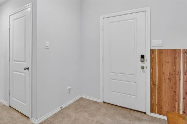 an empty room with closet area