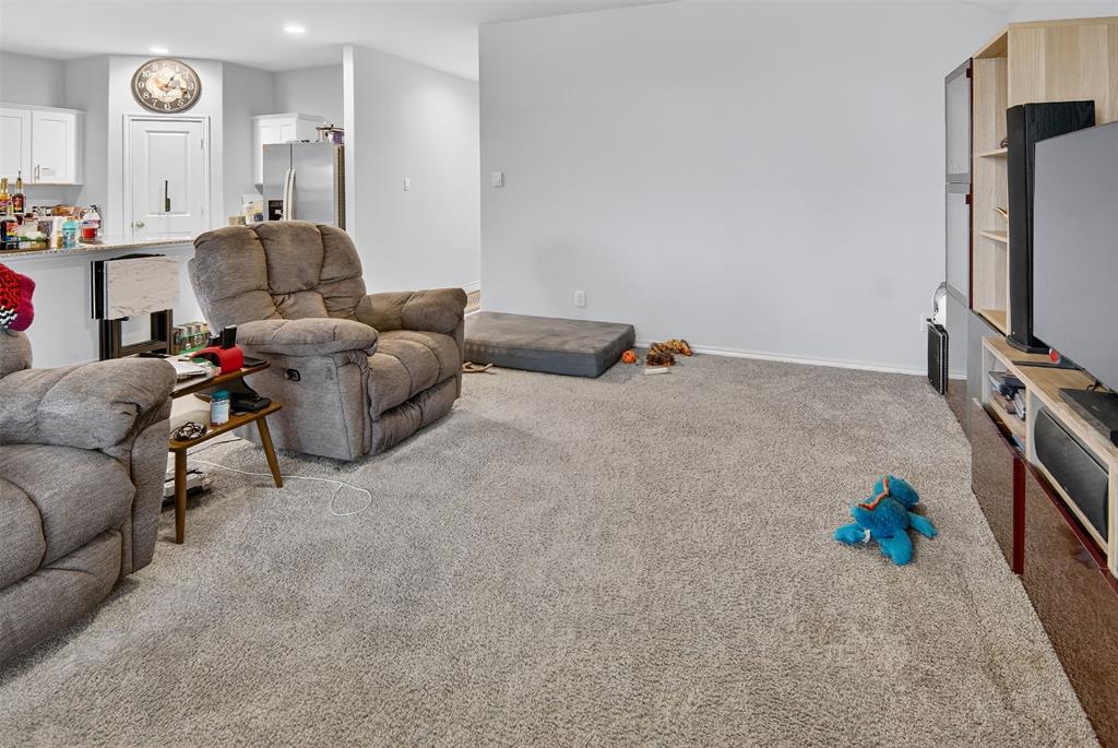 536 Bronze Circle East Springtown, TX 76082 - Photo 8 of 28 a living room with furniture and a flat screen tv