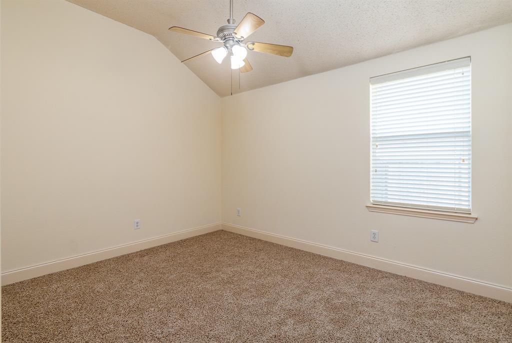 107 Hazelnut Trail Forney, TX 75126 - Photo 19 of 37 Another secondary bedroom with walk-in closet.