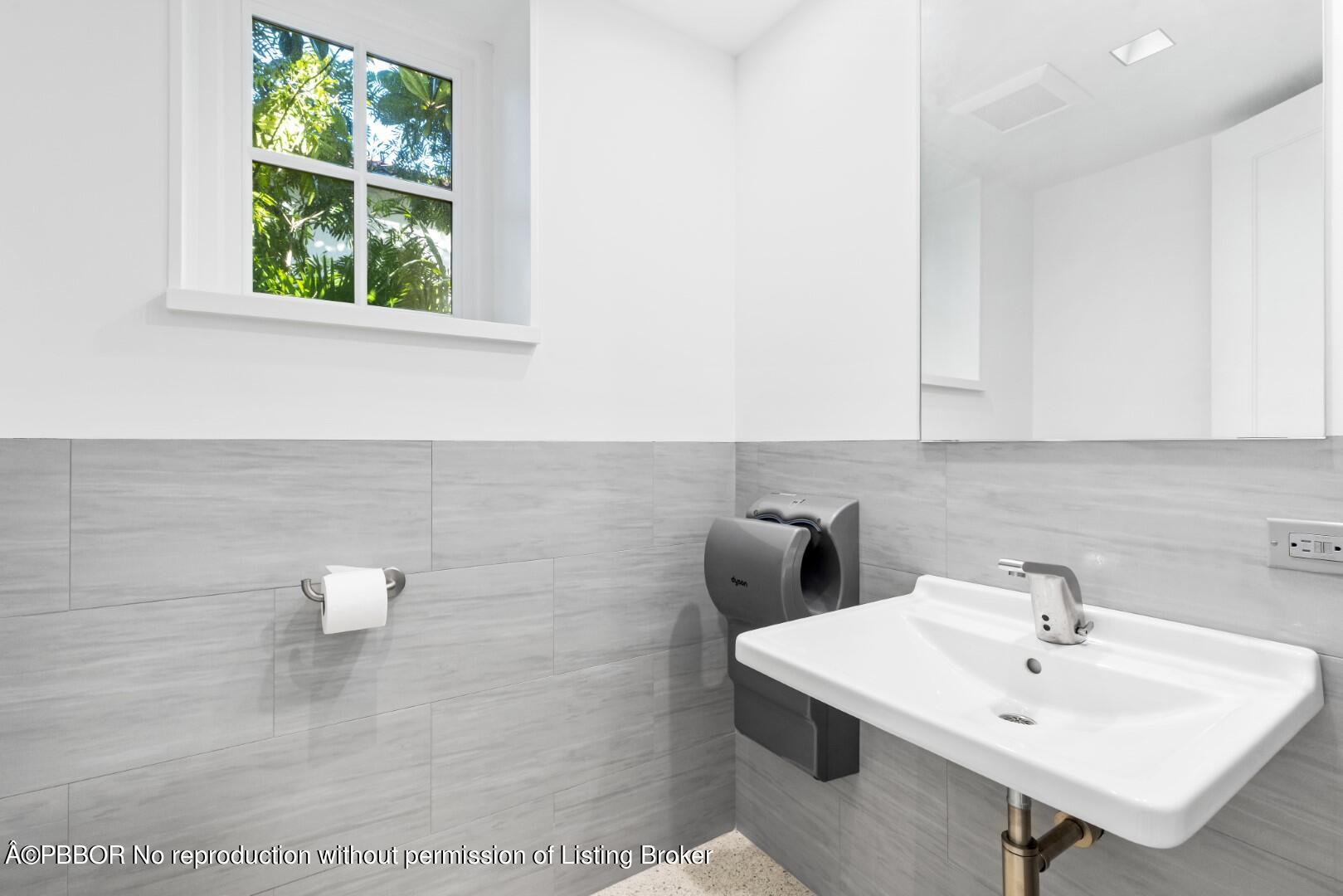 710 South County Road Palm Beach, FL 33480 - Photo 60 of 69 a bathroom with a sink and a mirror