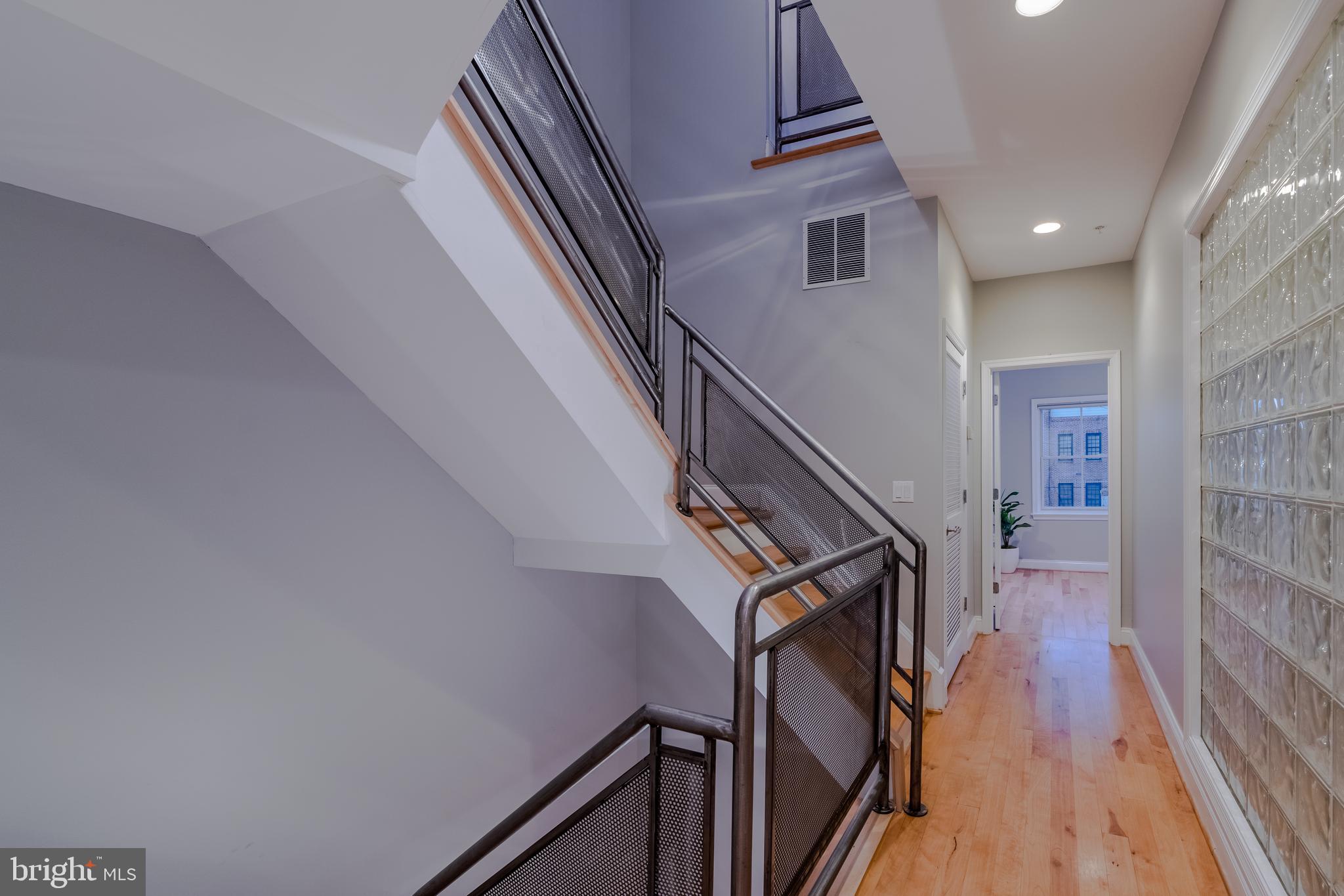 1715 Lancaster Street Baltimore, MD 21231 - Photo 16 of 68 a view of entryway with wooden floor and stairs