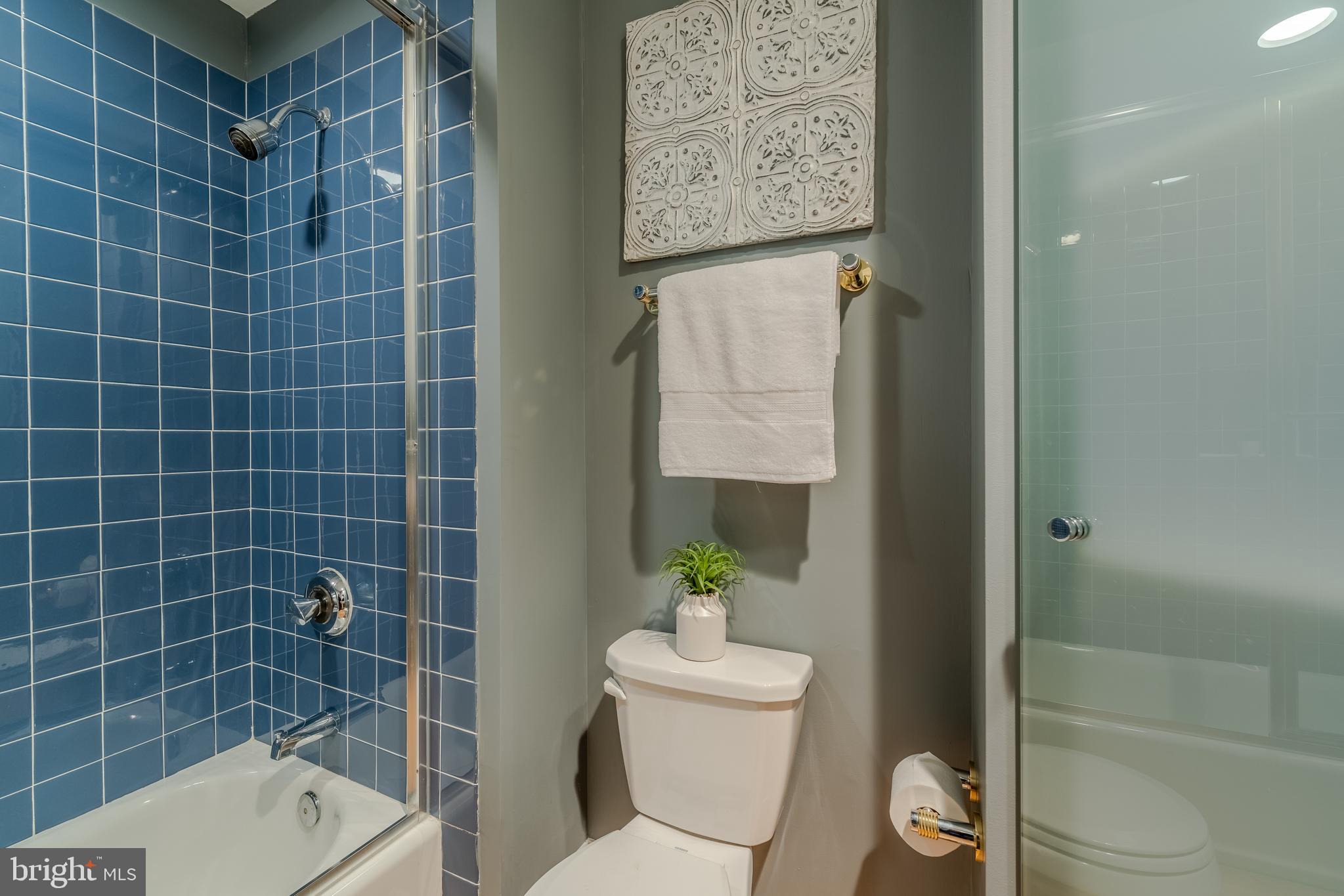 1715 Lancaster Street Baltimore, MD 21231 - Photo 25 of 68 a bathroom with a toilet and a shower