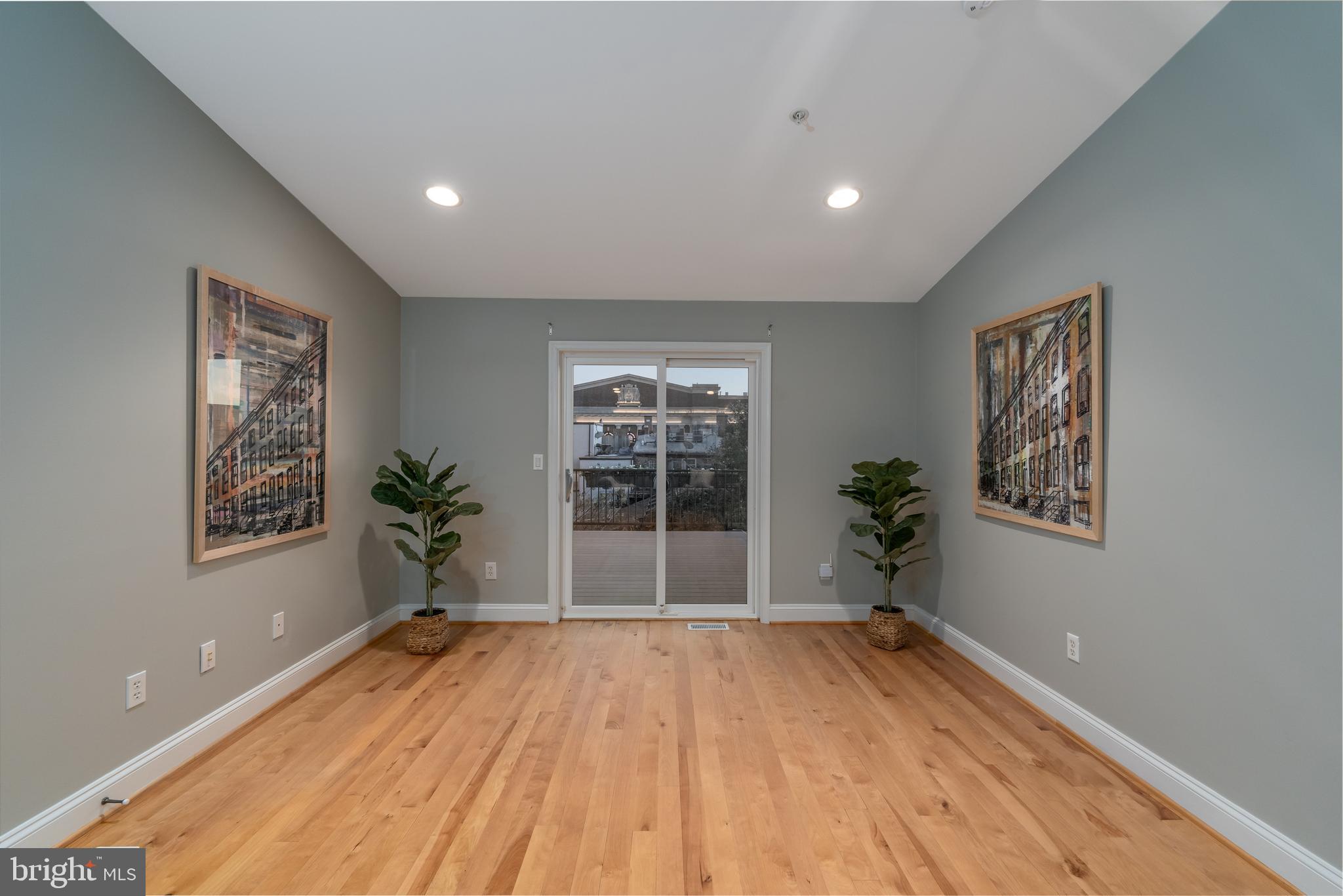 1715 Lancaster Street Baltimore, MD 21231 - Photo 29 of 68 a view of empty room with wooden floor and fan