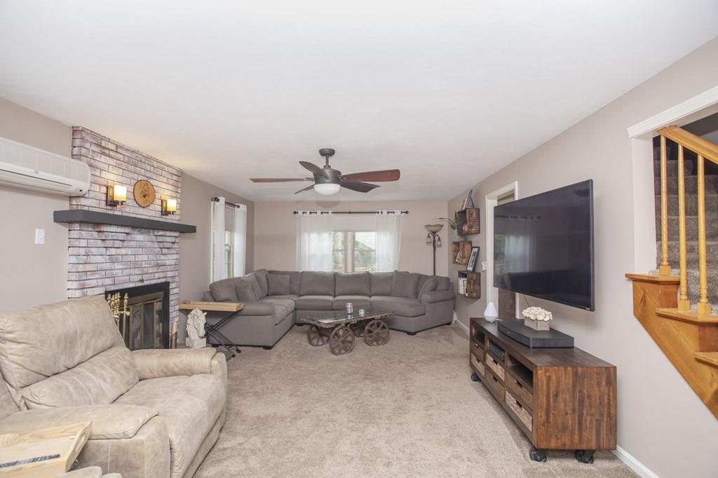 344 Walnut Plain Road Rochester, MA 02770 - Photo 17 of 42 a living room with furniture and a flat screen tv