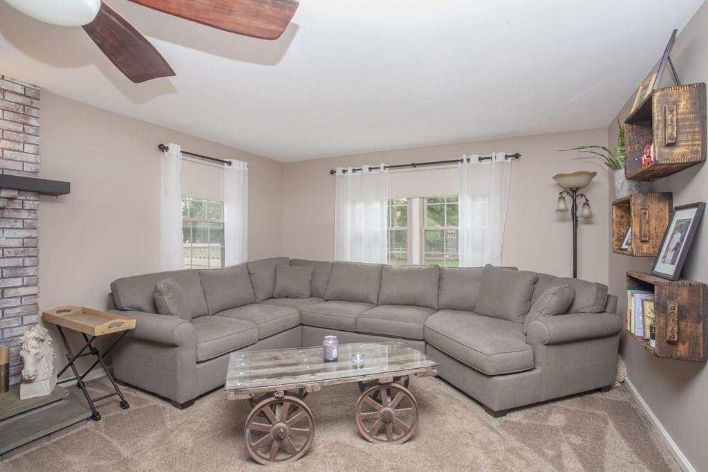 344 Walnut Plain Road Rochester, MA 02770 - Photo 19 of 42 a living room with furniture a couch and a flat screen tv