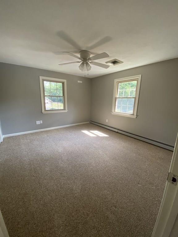 344 Walnut Plain Road Rochester, MA 02770 - Photo 25 of 42 an empty room with windows and fan