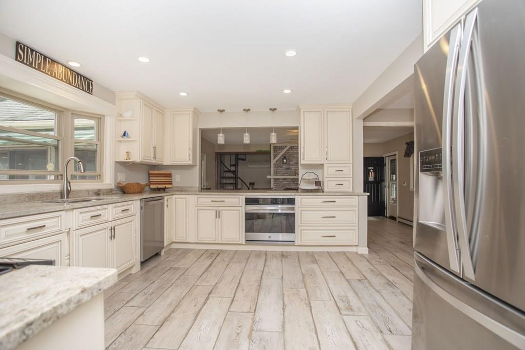 344 Walnut Plain Road Rochester, MA 02770 - Photo 10 of 42 a large kitchen with stainless steel appliances granite countertop a stove and a sink