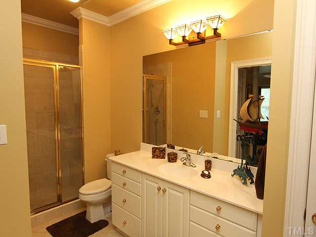 2604 St Marys Street Raleigh, NC 27609 - Photo 17 of 25 a bathroom with a sink a toilet and shower