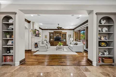 a view of living room with furniture and book shelf