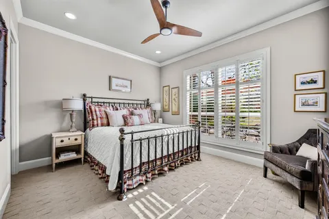 a bedroom with a bed and a couch