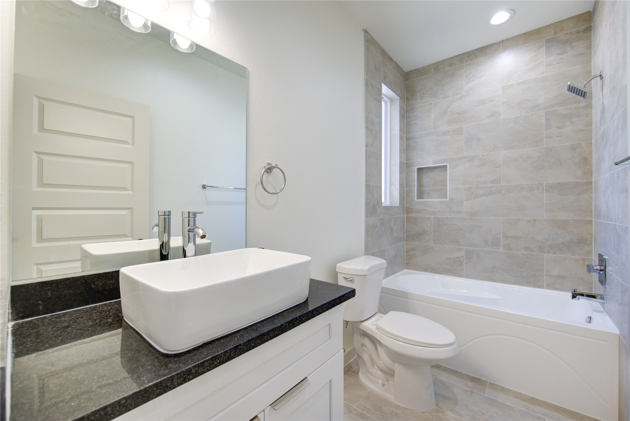 2912 El Fenice Lane Houston, TX 77057 - Photo 23 of 49 a bathroom with a sink a toilet and bathtub