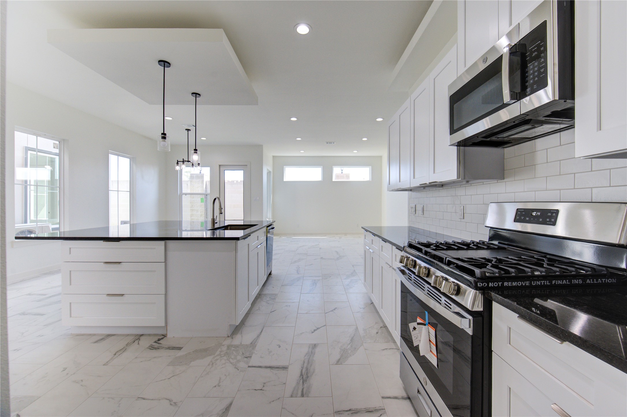 2912 El Fenice Lane Houston, TX 77057 - Photo 35 of 49 a kitchen with stainless steel appliances granite countertop a stove and a sink