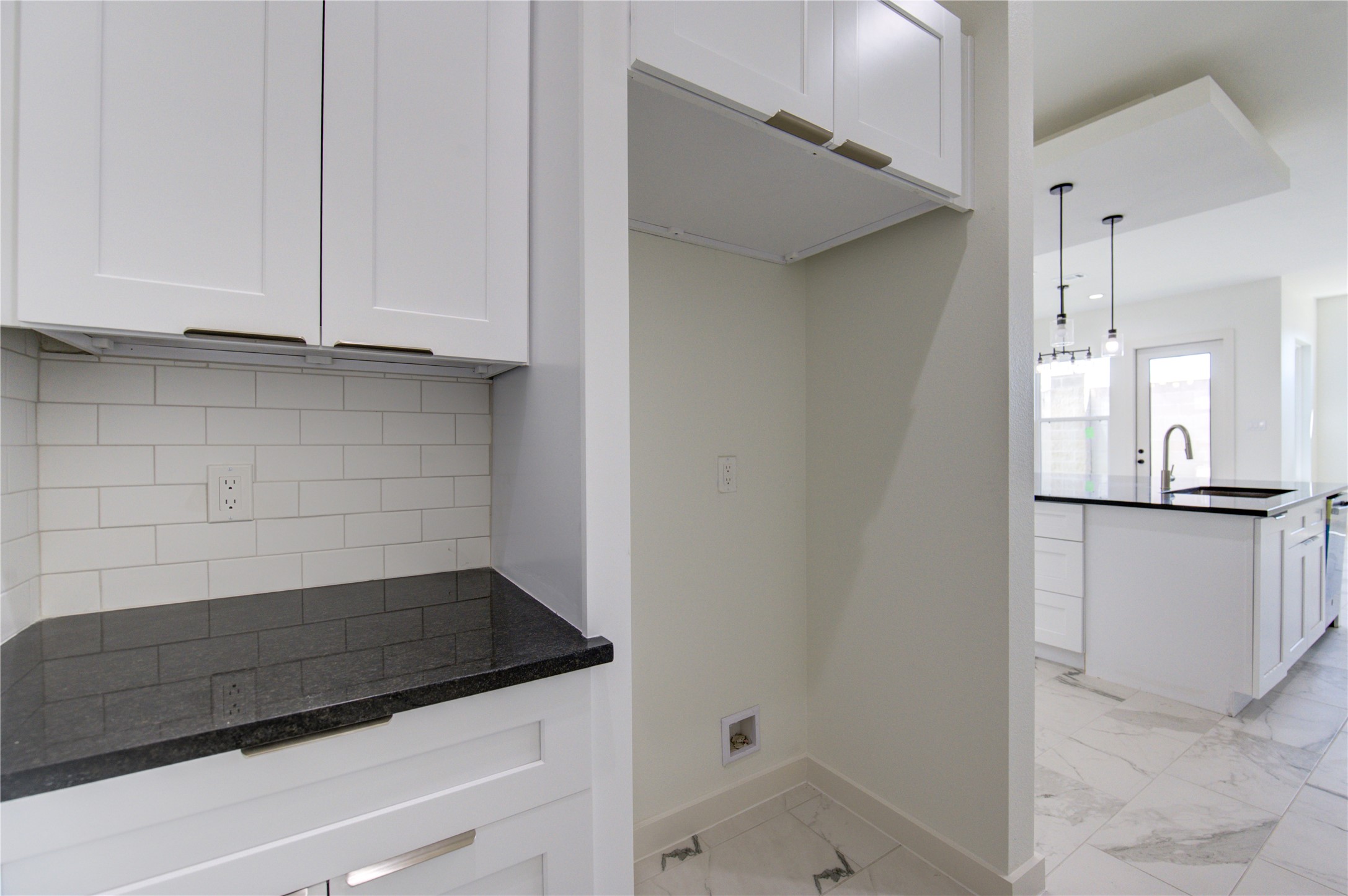 2912 El Fenice Lane Houston, TX 77057 - Photo 36 of 49 a view of kitchen and utility room