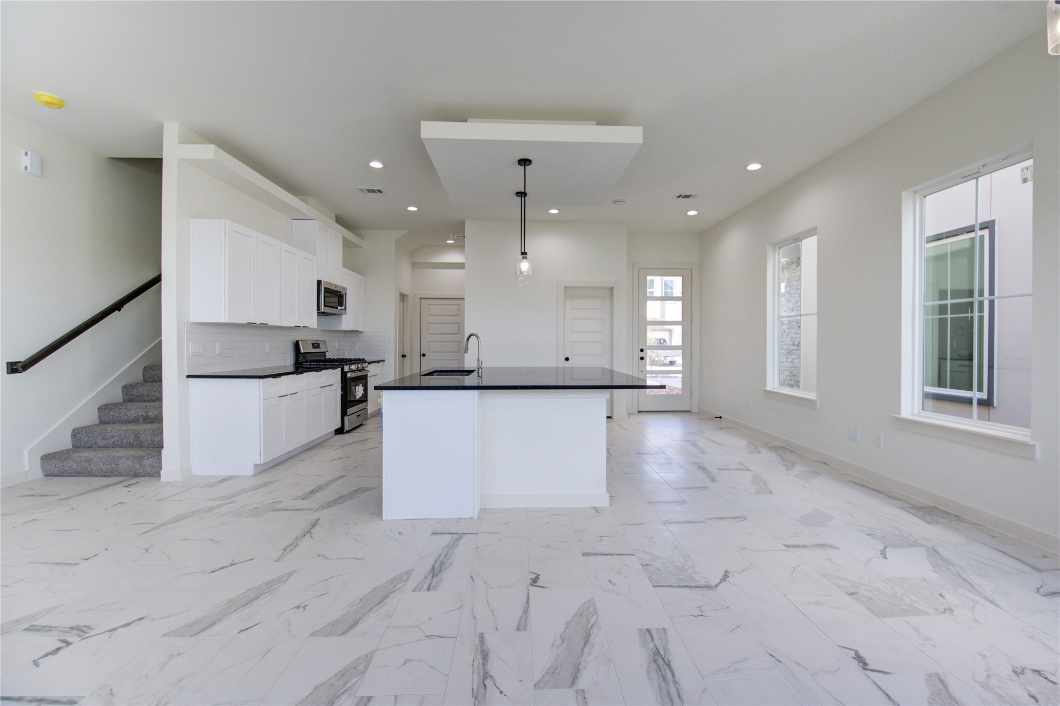 2912 El Fenice Lane Houston, TX 77057 - Photo 40 of 49 a view of kitchen with refrigerator and white cabinets
