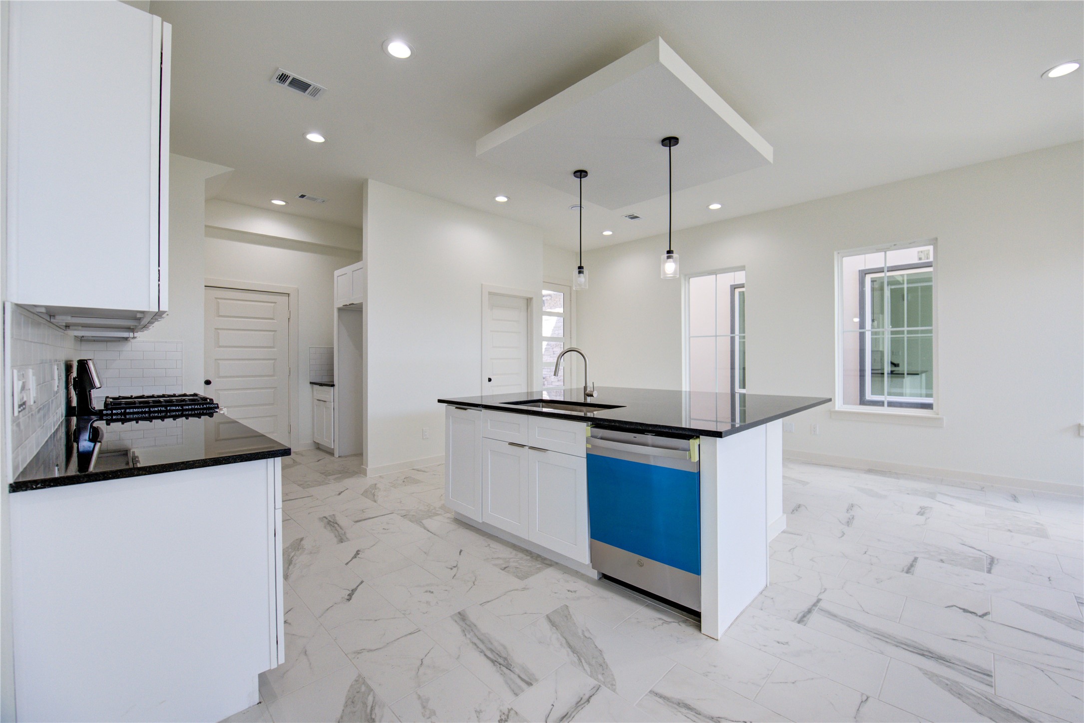 2912 El Fenice Lane Houston, TX 77057 - Photo 41 of 49 a kitchen with stainless steel appliances granite countertop a sink and a stove