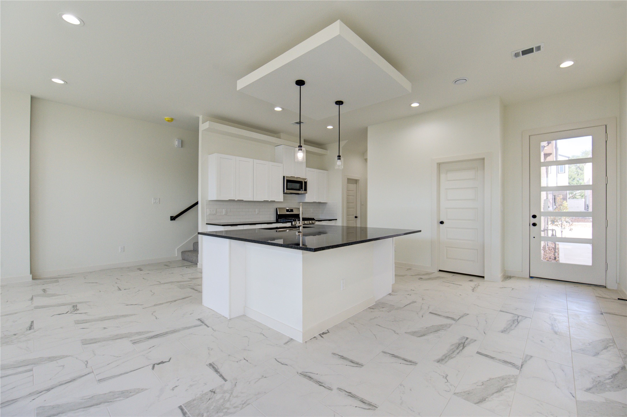 2912 El Fenice Lane Houston, TX 77057 - Photo 43 of 49 a large kitchen with stainless steel appliances a large counter top a stove and a refrigerator